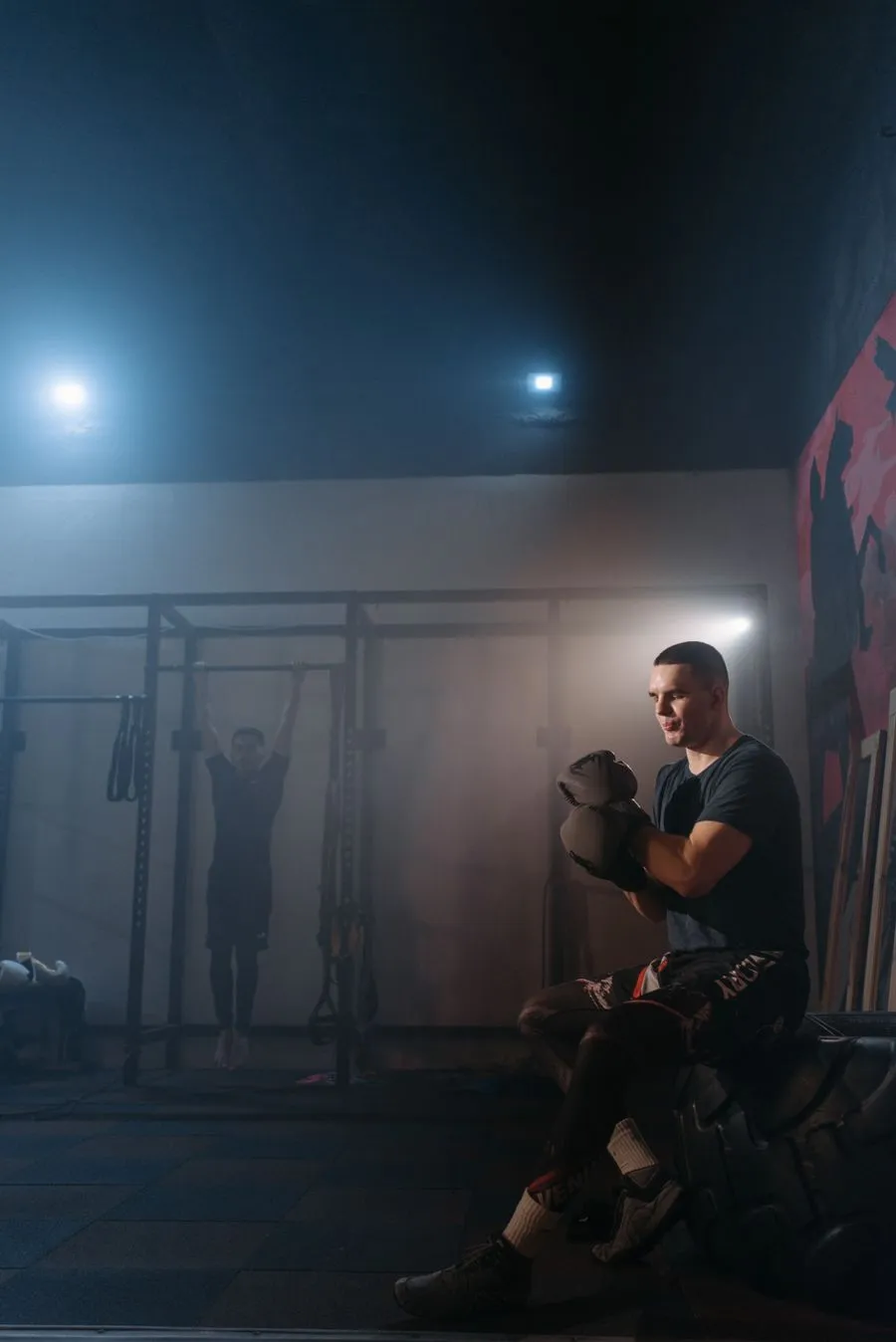 Man in boxing gloves working the bag