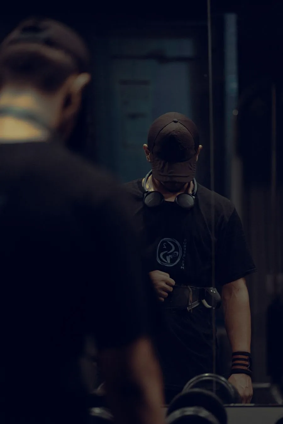 Man in a cap in a dark room